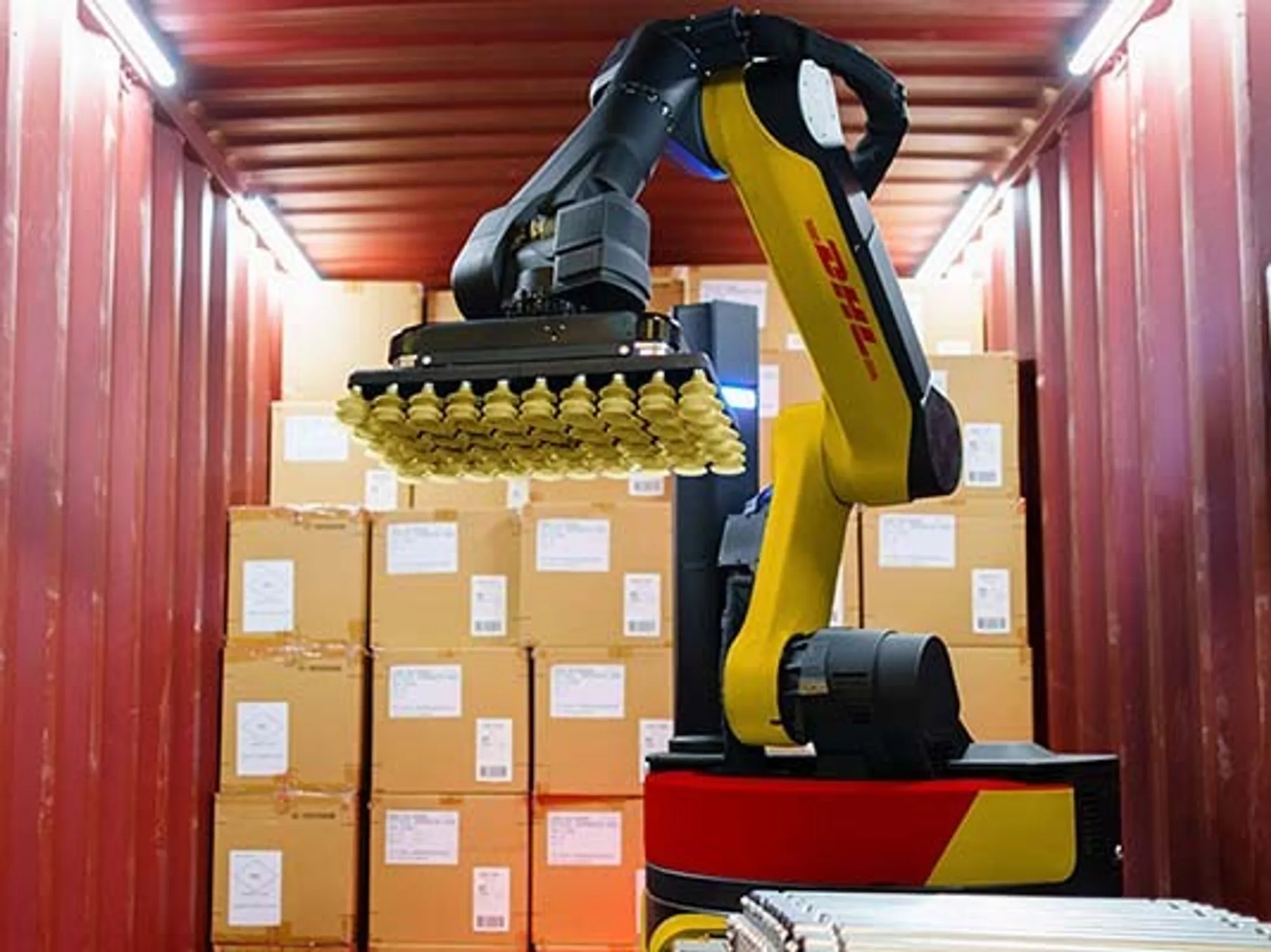 Autonomous robots loading a truck at a warehouse dock